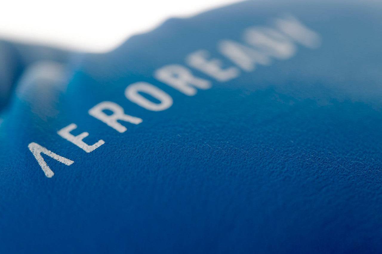 Close-up of blue ADIDAS Hybrid25 glove with AEROREADY branding, highlighting moisture-wicking surface.